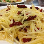 Potato with vinegar, chilli oil and dried chillis