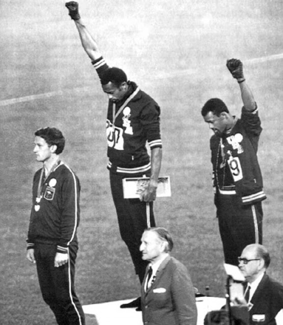 The 1968 Olympics Black Power Salute: African American athletes Tommie Smith and John Carlos raise their fists in a gesture of solidarity at the 1968 Olympic games. Australian Silver medalist Peter Norman wore an Olympic Project for Human Rights badge in support of their protest. Both Americans were expelled from the games as a result.