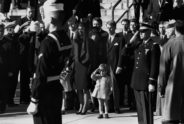 John F. Kennedy Jr. salutes his father's coffin along with the honor guard.