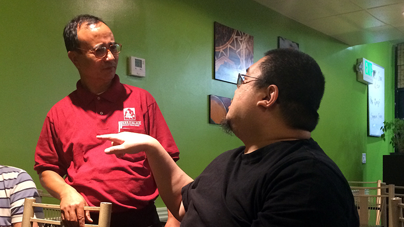 Rinpoche teases a Nepali waiter at an Indian restaurant
