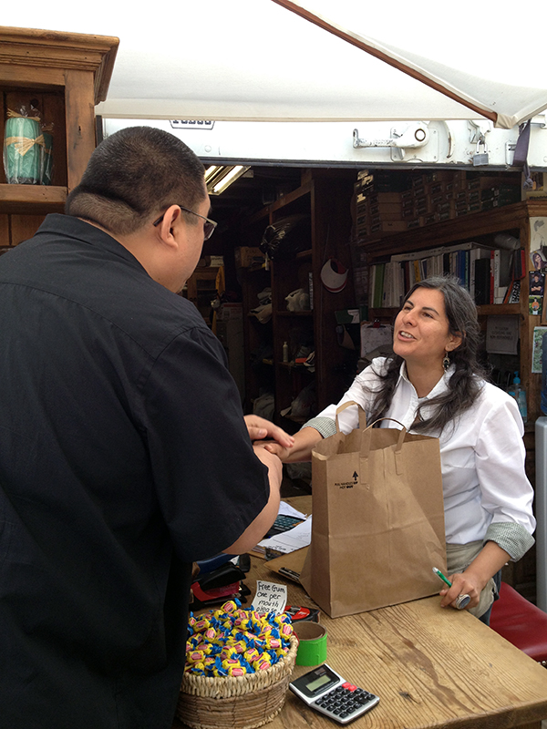 Rinpoche promising this lovely lady that he will use the bowls she gifted him to make offerings on her behalf