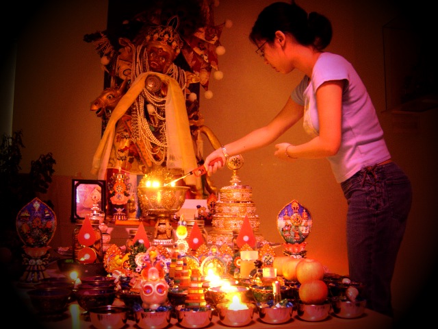 Jean Mei lights the candles in front of Setrap during our Protector retreat