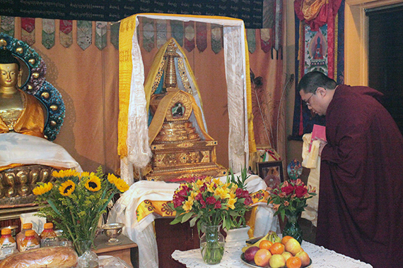 Rinpoche paying respects and making offerings at the reliquary stupa of His Eminence Domo Geshe Rinpoche in Domo Ladrang, New York (USA).